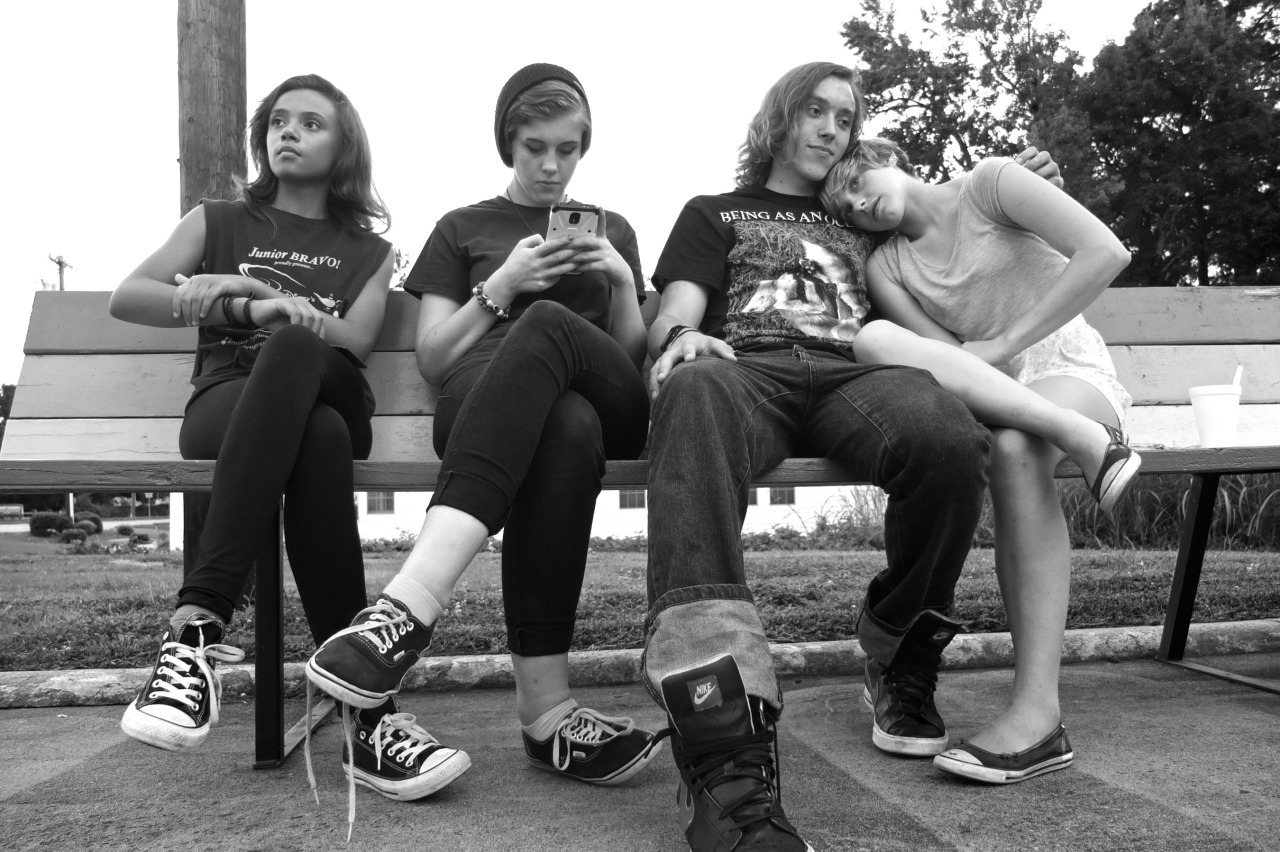 black and white photo of casual group of teenagers
