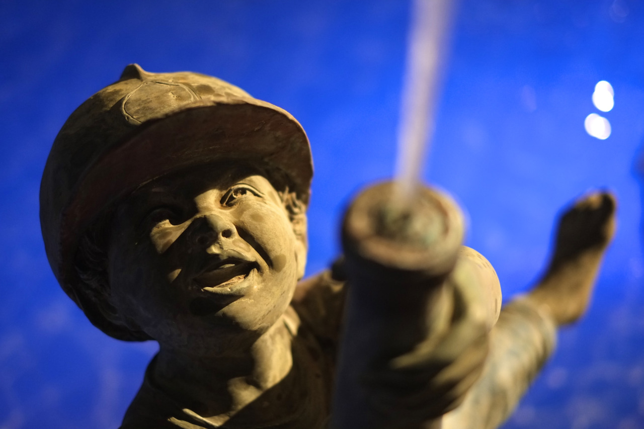 statue of a boy with firehose