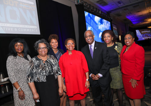 A group of business people with Cora Cole-McFadden and Mayor Bill Bell