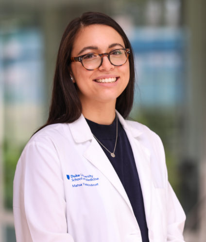 Portrait of a female doctor with a building reflection soft behind her