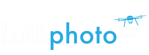 Logo for HuthPhoto air with tiny drone flying off