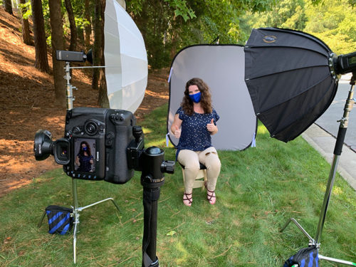 image of COVID masked woman in a safe photo portrait setup outside