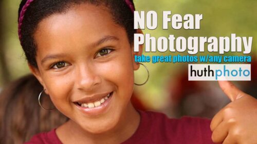 Girl gives a thumbs up and text reads "No Fear Photography"