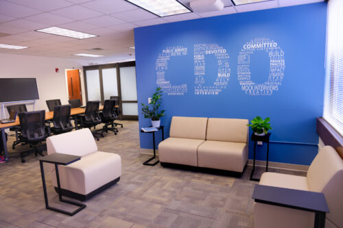 image of a contemporary space with a large blue wall with the letters "CDO" made up of smaller words