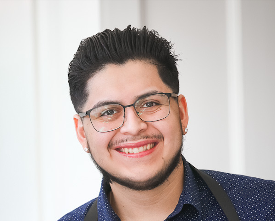 teen boy smiling in a colorful stage are